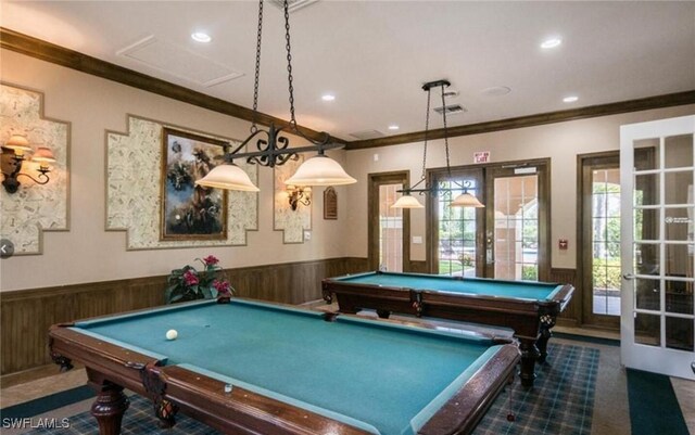 rec room featuring french doors, billiards, and wood walls