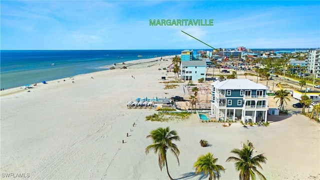 bird's eye view featuring a water view and a view of the beach