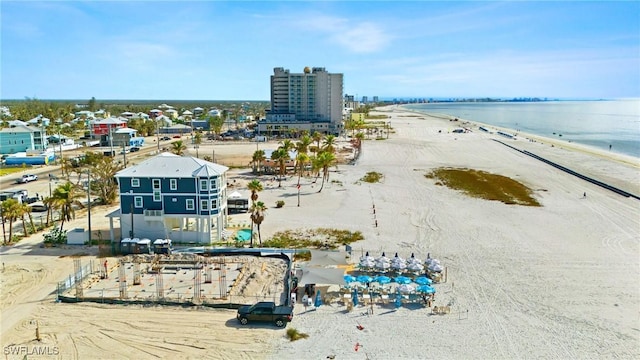 aerial view featuring a water view and a beach view