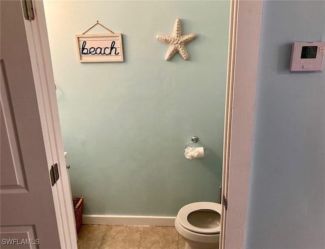 bathroom featuring tile patterned flooring and toilet