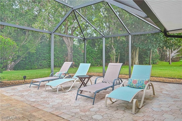 view of patio featuring a lanai