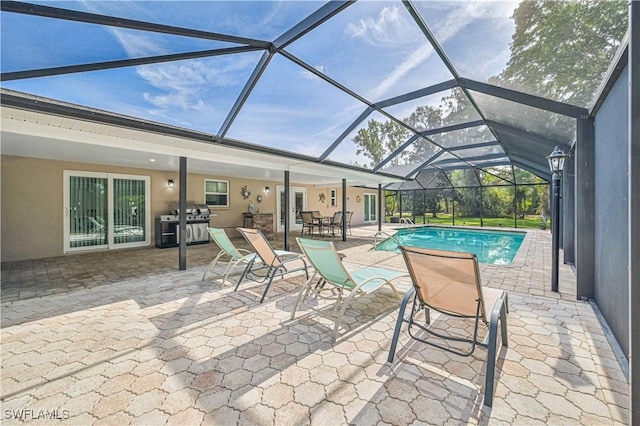 view of pool featuring a patio area and a lanai