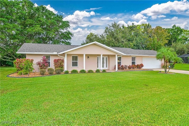 single story home featuring a garage and a front lawn