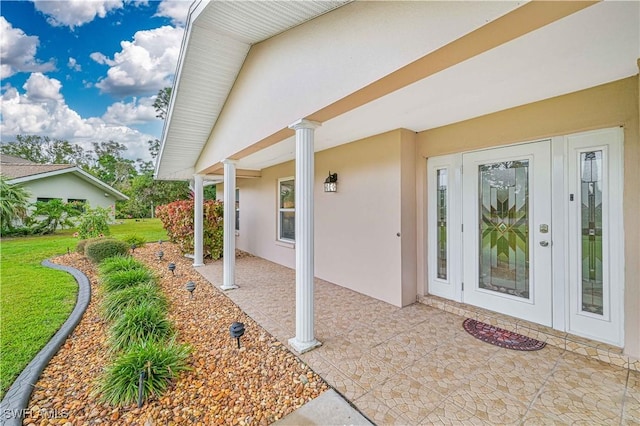 entrance to property featuring a patio