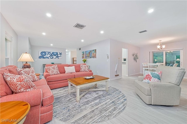 living room with an inviting chandelier