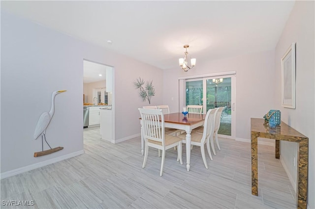 dining area with a notable chandelier