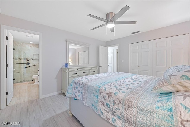 bedroom with ensuite bathroom, a closet, ceiling fan, and light hardwood / wood-style flooring