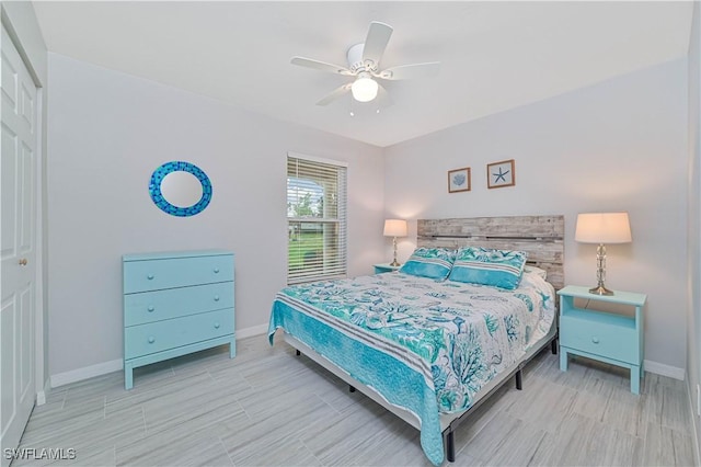 bedroom featuring ceiling fan and a closet