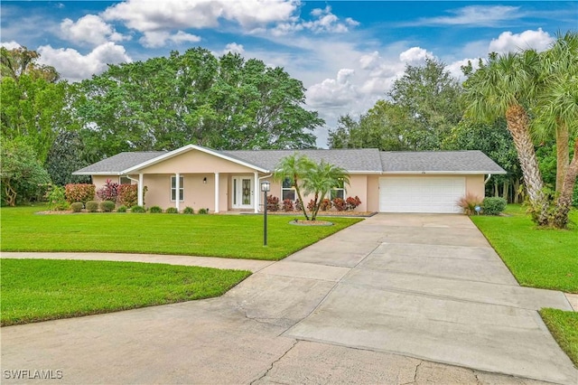 ranch-style home with a garage and a front yard