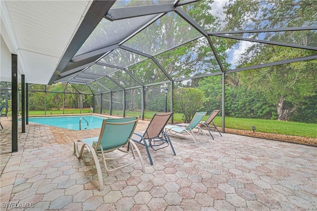 view of swimming pool featuring a lanai and a patio area