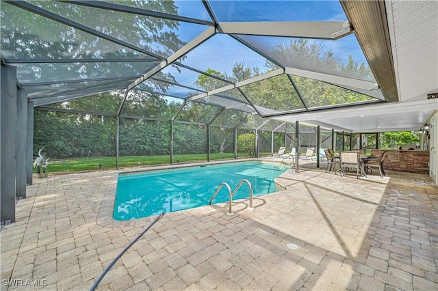 view of swimming pool featuring a lanai and a patio area