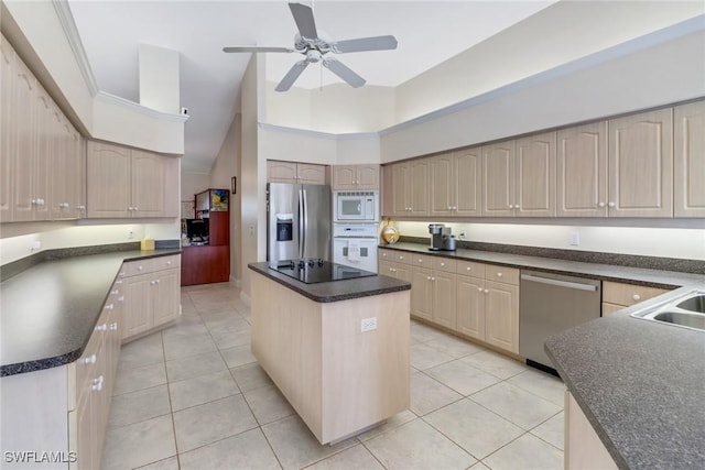 kitchen with a center island, high vaulted ceiling, light tile patterned flooring, and appliances with stainless steel finishes