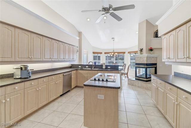 kitchen featuring a center island, light tile patterned flooring, lofted ceiling, and hanging light fixtures