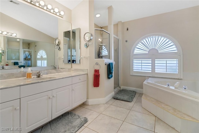 bathroom featuring tile patterned floors, plenty of natural light, independent shower and bath, and vaulted ceiling