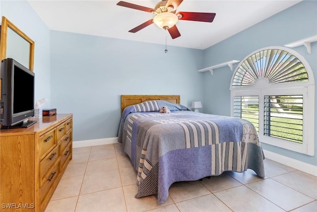 tiled bedroom with ceiling fan