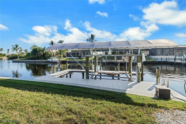 view of dock featuring a yard and a water view