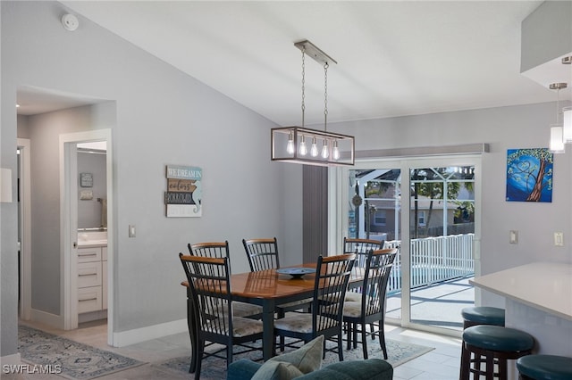 dining room featuring vaulted ceiling