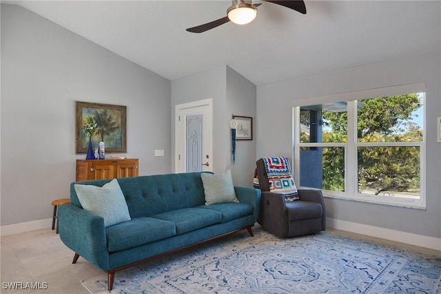 living room with ceiling fan and lofted ceiling