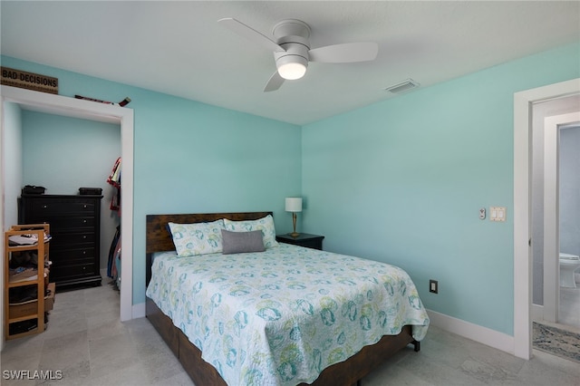 bedroom featuring ensuite bath and ceiling fan