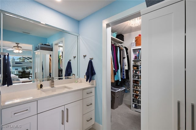 bathroom featuring ceiling fan and vanity