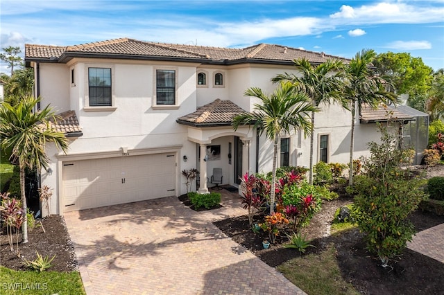 mediterranean / spanish-style house featuring a garage