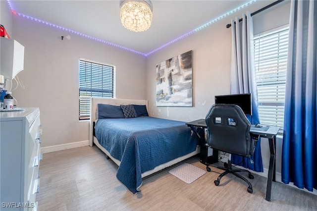 bedroom featuring a notable chandelier