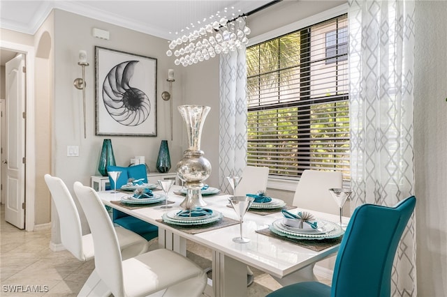 dining space featuring a chandelier and ornamental molding