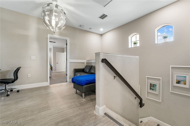 stairway with hardwood / wood-style flooring