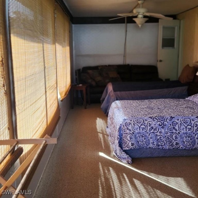 bedroom featuring ceiling fan and carpet floors