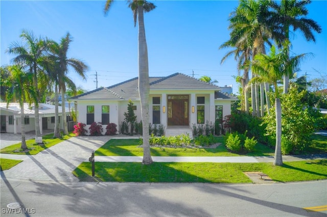 view of front of home with a front yard