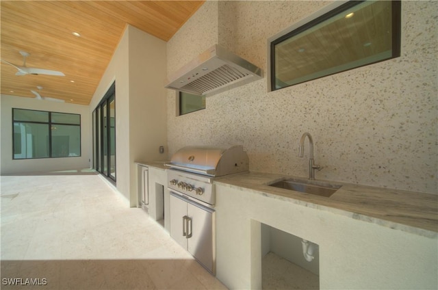 view of patio / terrace featuring area for grilling, sink, ceiling fan, and an outdoor kitchen