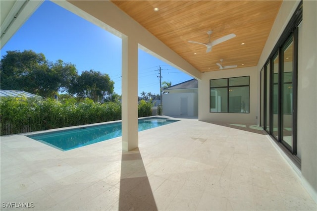 view of pool with ceiling fan and a patio area