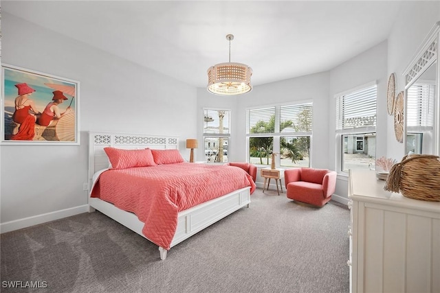 bedroom featuring carpet floors and a chandelier