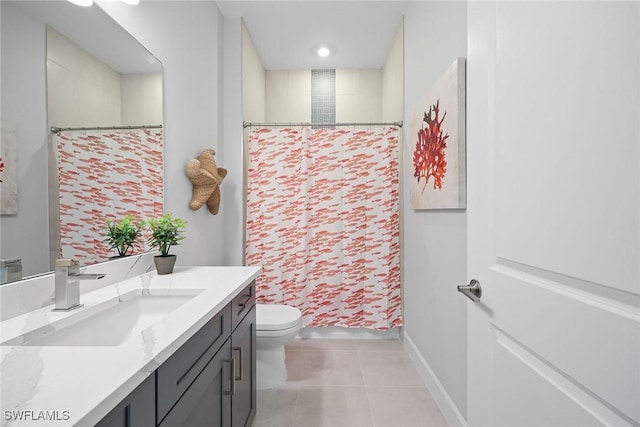 bathroom featuring curtained shower, tile patterned flooring, vanity, and toilet