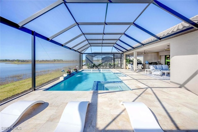 view of pool with glass enclosure, ceiling fan, an in ground hot tub, a water view, and a patio