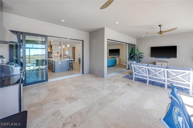 living room with ceiling fan