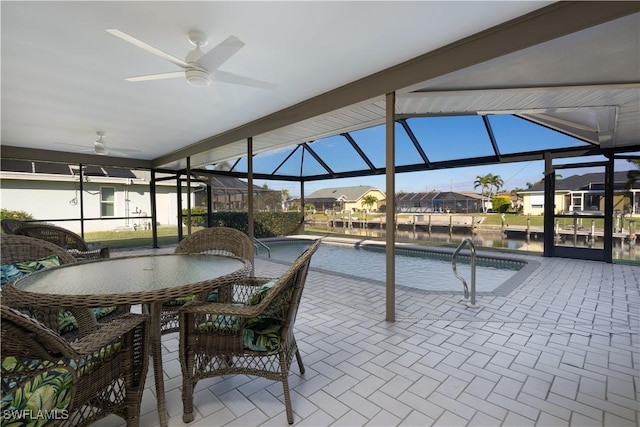 interior space with ceiling fan and pool water feature