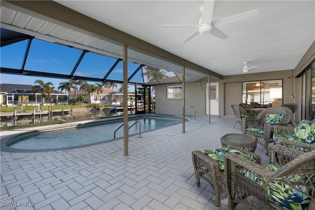 view of pool featuring a water view and ceiling fan