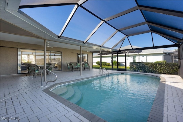 view of pool featuring ceiling fan, a lanai, and a patio