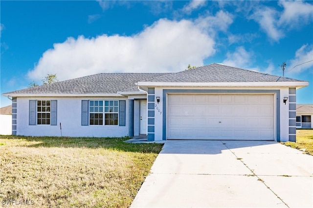 ranch-style house with a garage and a front yard