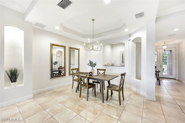 dining space with light tile patterned floors, an inviting chandelier, french doors, and crown molding