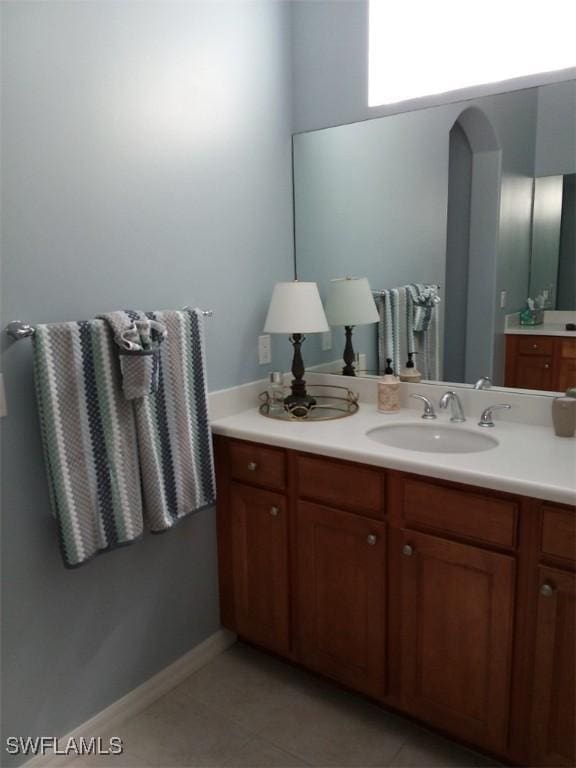 bathroom featuring tile patterned flooring and vanity