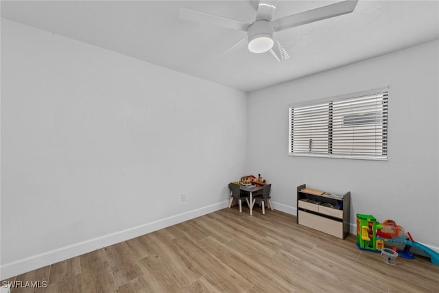 game room featuring ceiling fan and light wood-type flooring