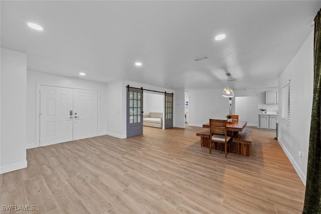 dining room with light wood-type flooring