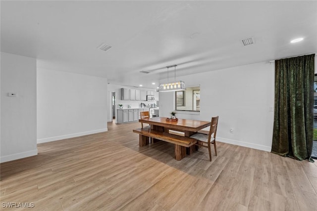 dining area featuring light hardwood / wood-style flooring