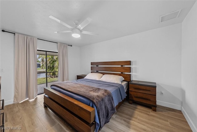 bedroom featuring access to exterior, light hardwood / wood-style flooring, and ceiling fan