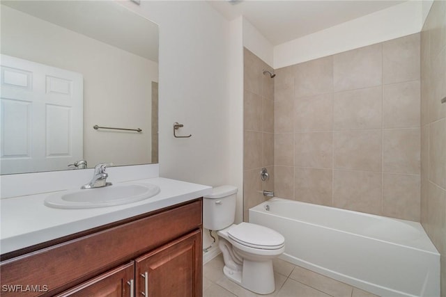 full bathroom featuring vanity, tiled shower / bath combo, tile patterned floors, and toilet