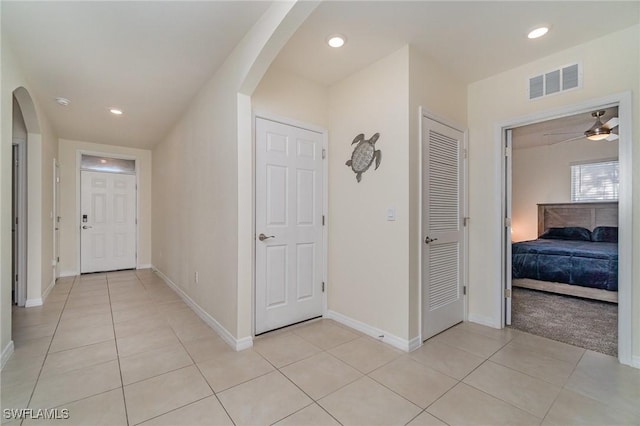 hallway featuring light tile patterned flooring