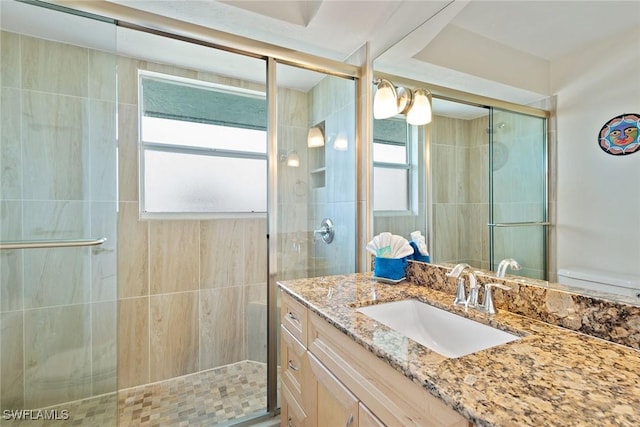 bathroom with vanity and an enclosed shower