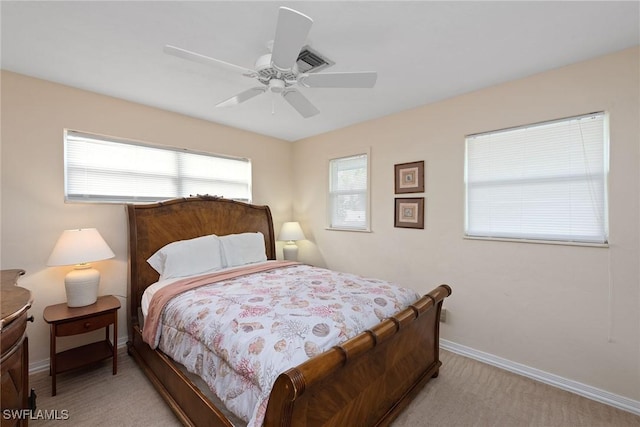 bedroom with ceiling fan and light carpet